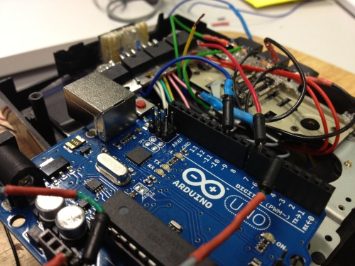 Arduino Uno hooked up to bluetooth controller, buttons and transistors.