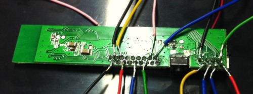 Bluetooth controller with first wires soldered onto it.